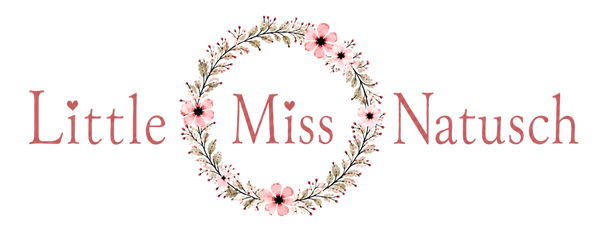 A decorative logo on a white background reading 'Little Miss Natusch' in dusty pink lettering, with a floral wreath framing the center.